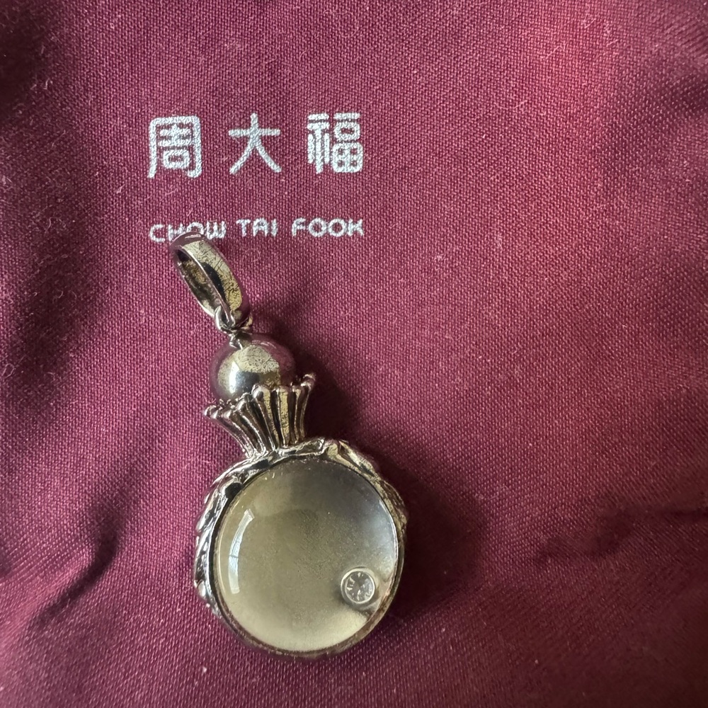 Chow Tai Fook 80 year anniversary silver pendant with a small diamond
